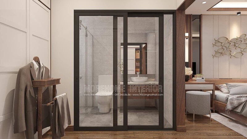 Thiết kế nội thất phòng ngủ khép kín với xu hướng mở khi sử dụng tấm ốp tường gỗ óc chó như tạo ranh giới phân chia cùng thiết kế cửa kính trượt.